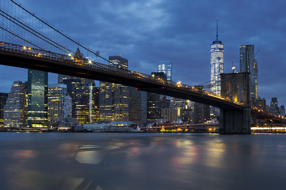 View of New York City Manhattan Midtown at Dusk With Brooklyn Bridge.