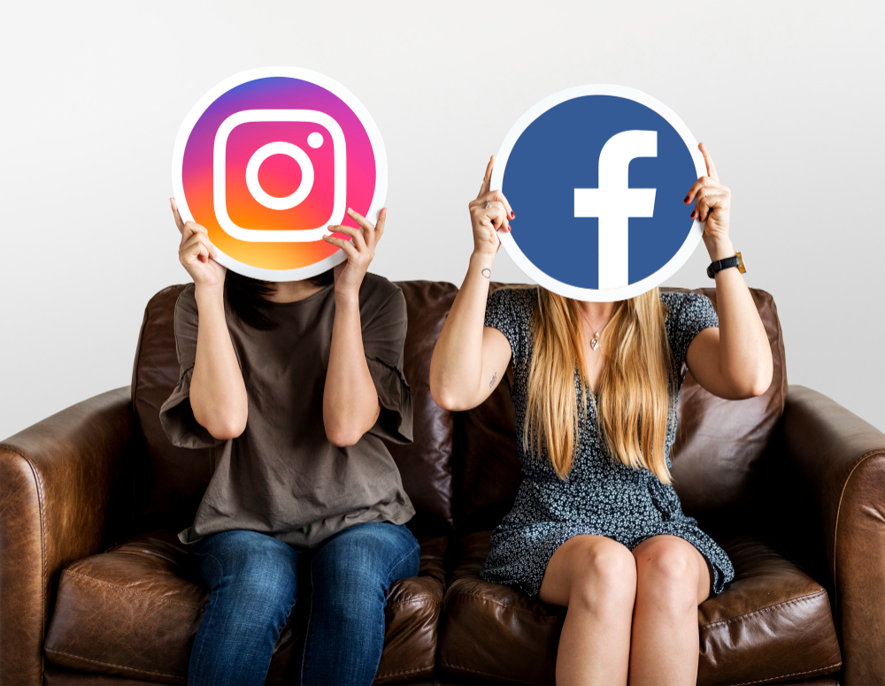 People Holding Social Media Icons