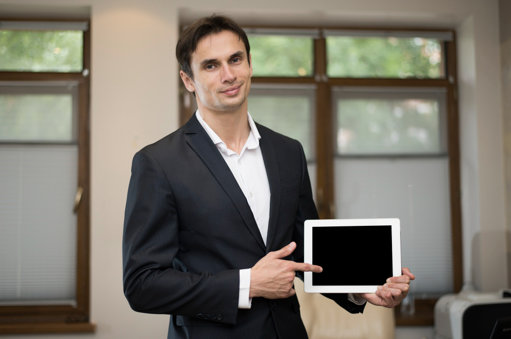 Medium Shot of Businessman Holding Tablet 