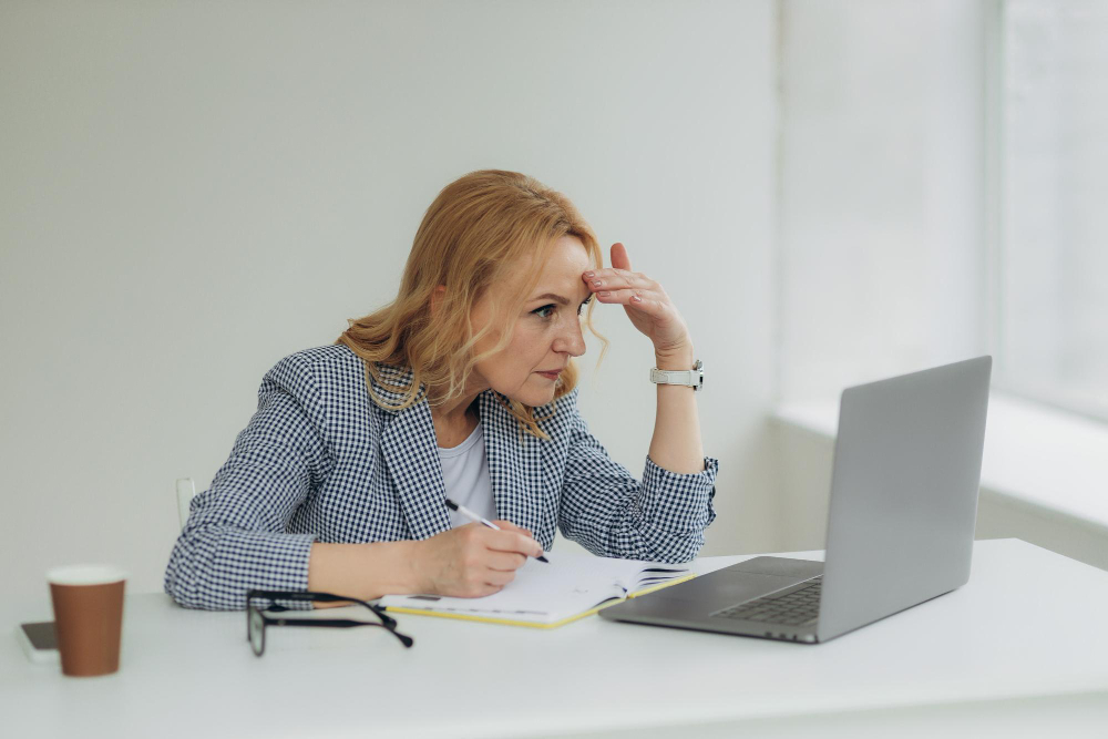 Thoughtful Confused Mature Business Woman Concerned Thinking About Online Problem