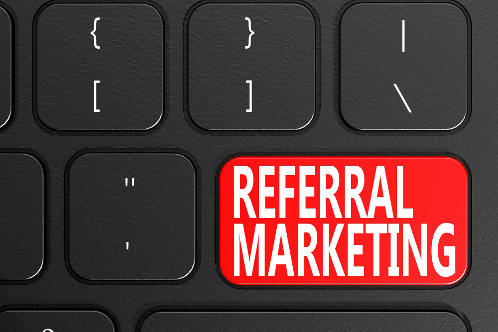 Referral Marketing on Black Keyboard