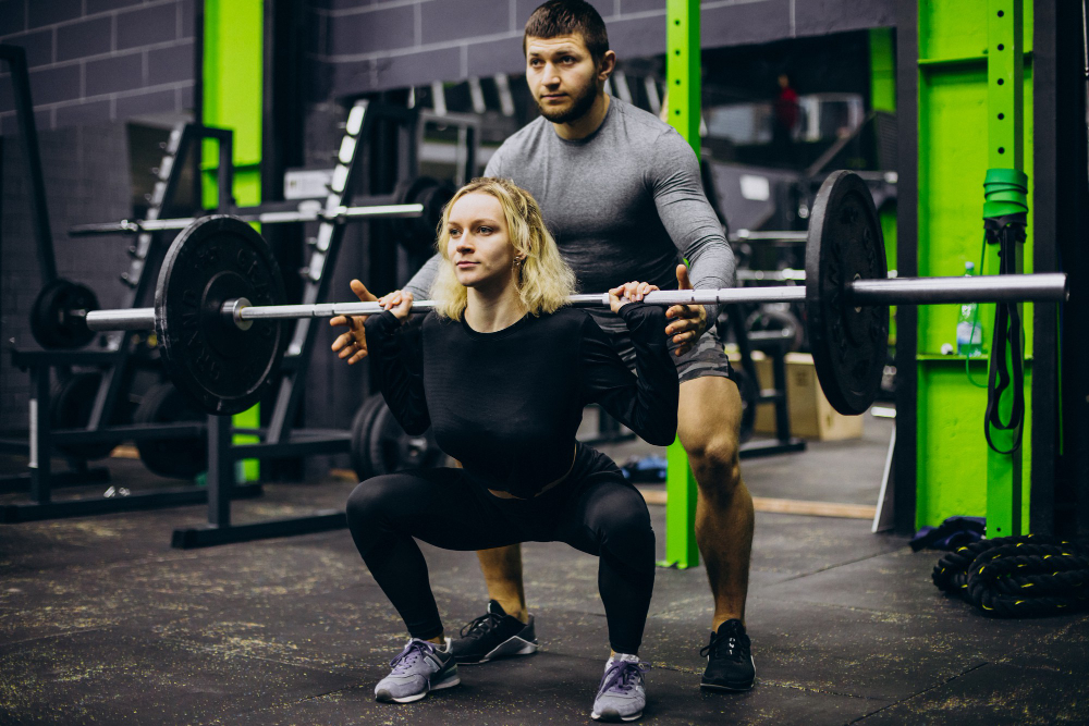 Couple Training Together at the Gym
