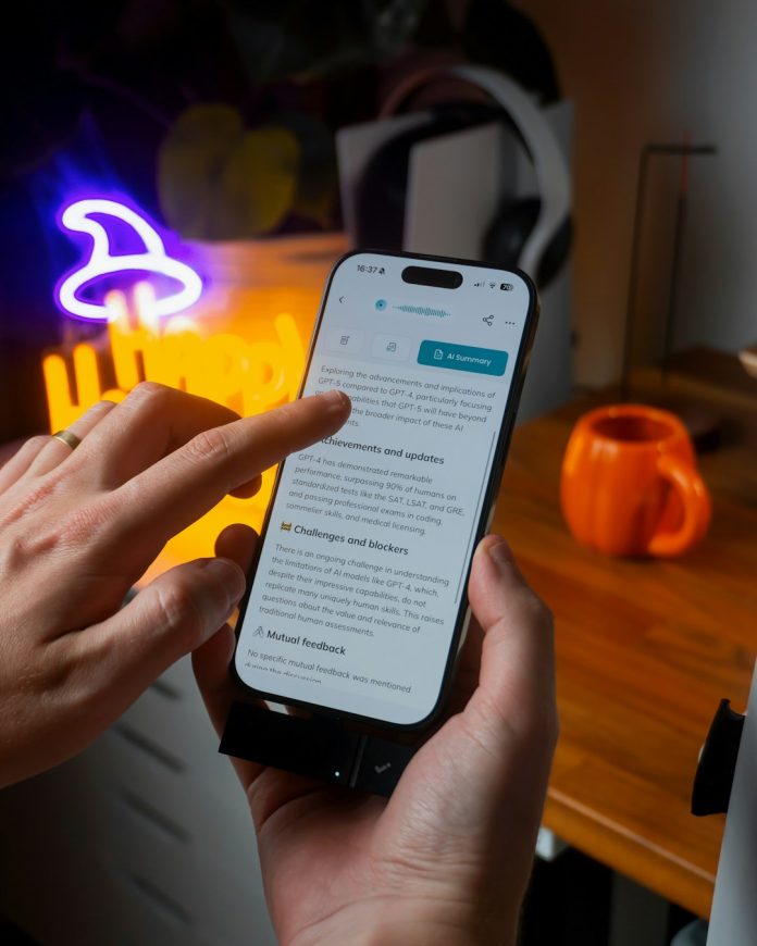 Hands holding smartphone with text on screen future artificial intelligence progress innovation