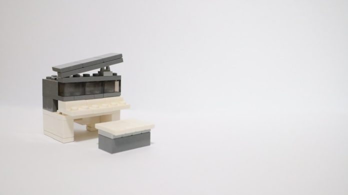 a lego model of a building with a roof 3d printed dock, diy switch stand, home setup