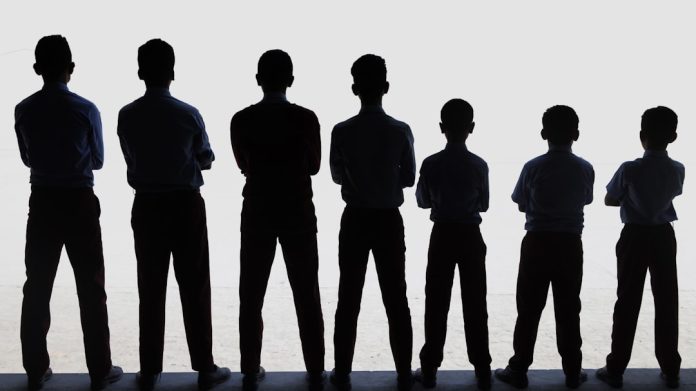 A group of people standing next to each other security hierarchy, team management, uniformed personnel