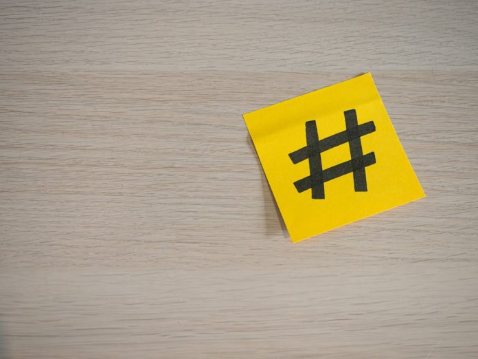 a yellow piece of paper with a hash symbol on it buzzsumo dashboard trending keywords social performance
