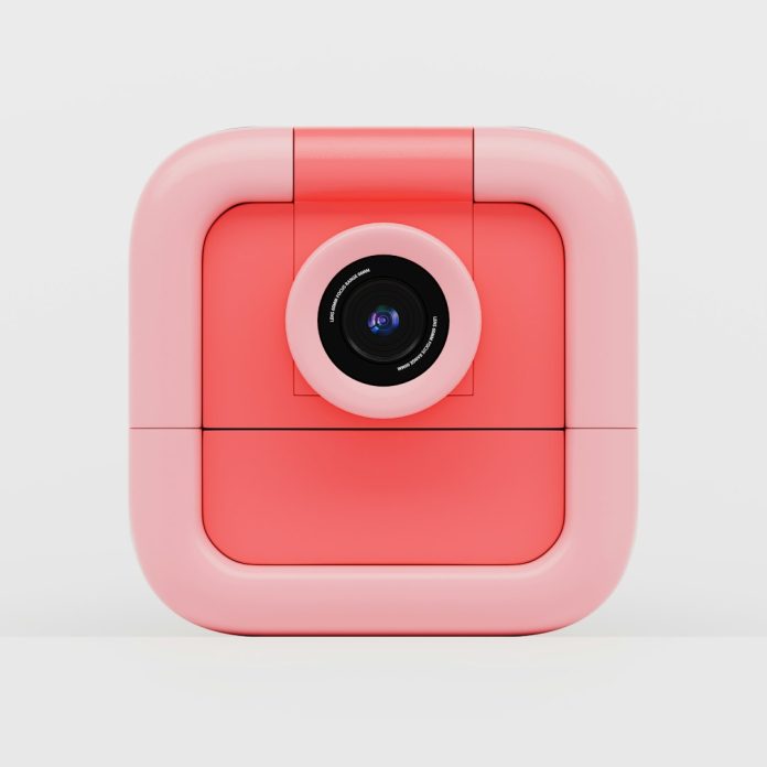 A pink and red square-shaped camera. instagram feed, selfie tips, social media phone, likes