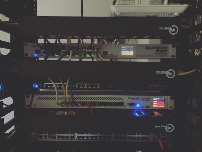 black steel electronic device server rack home lab setup network cables blinking lights