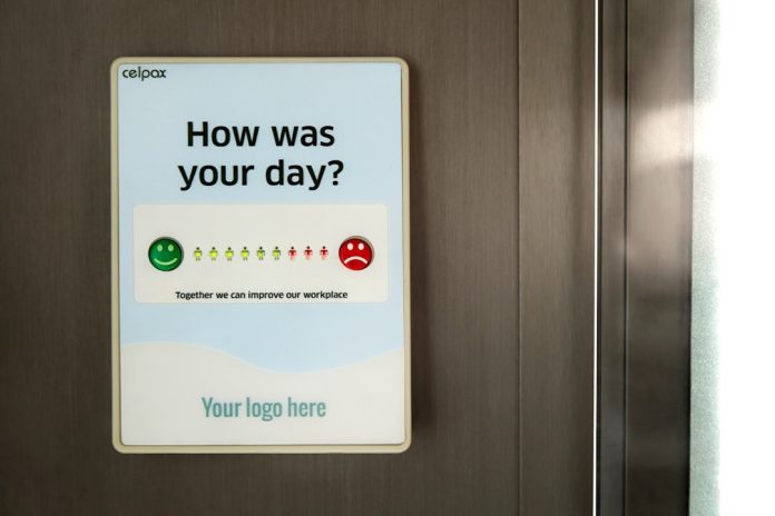 a close up of a metal door with a sign on it team feedback, pulse survey, employee sentiment