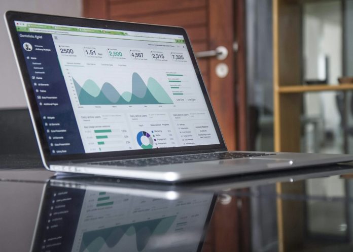 laptop computer on glass-top table productivity dashboard screen time analytics charts laptop