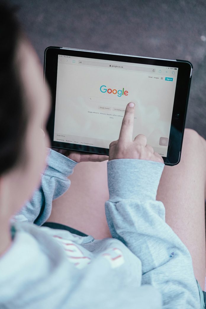 person holding black android smartphone app store optimization, keyword research, mobile advertising