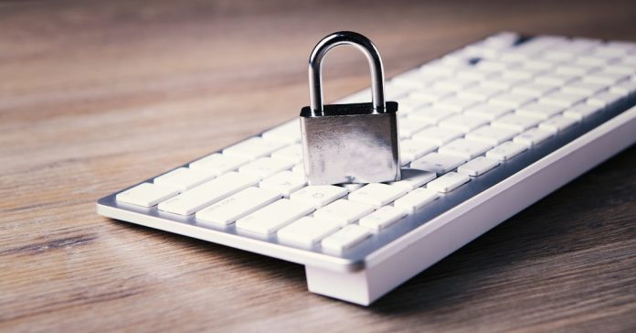 a computer keyboard with a padlock on top of it data breach, encryption, online privacy