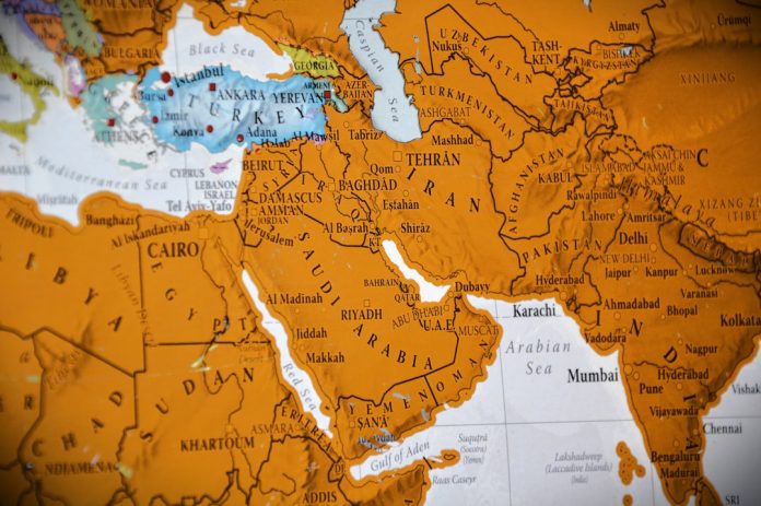 Close-up of a world map showing the middle east. global marketing, social media dashboard, international team