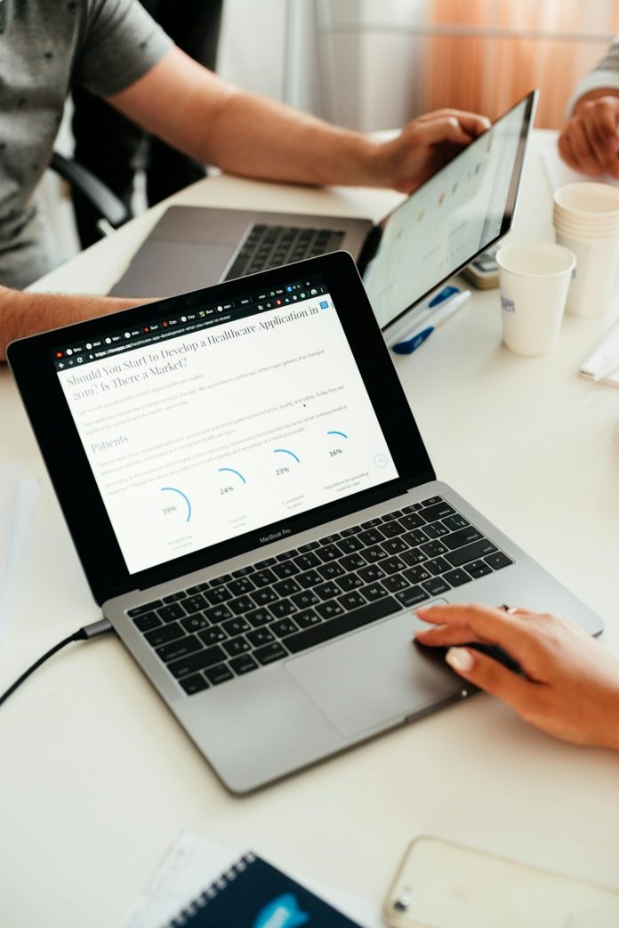 person using MacBook sales team, lead nurturing, email workflow
