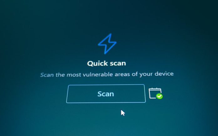 Quick scan button on a blue background defi wallet warning, token approval, hacker screen